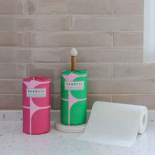 Tissue tolls in bathroom placed in the rob holder with tissues inscrolled.