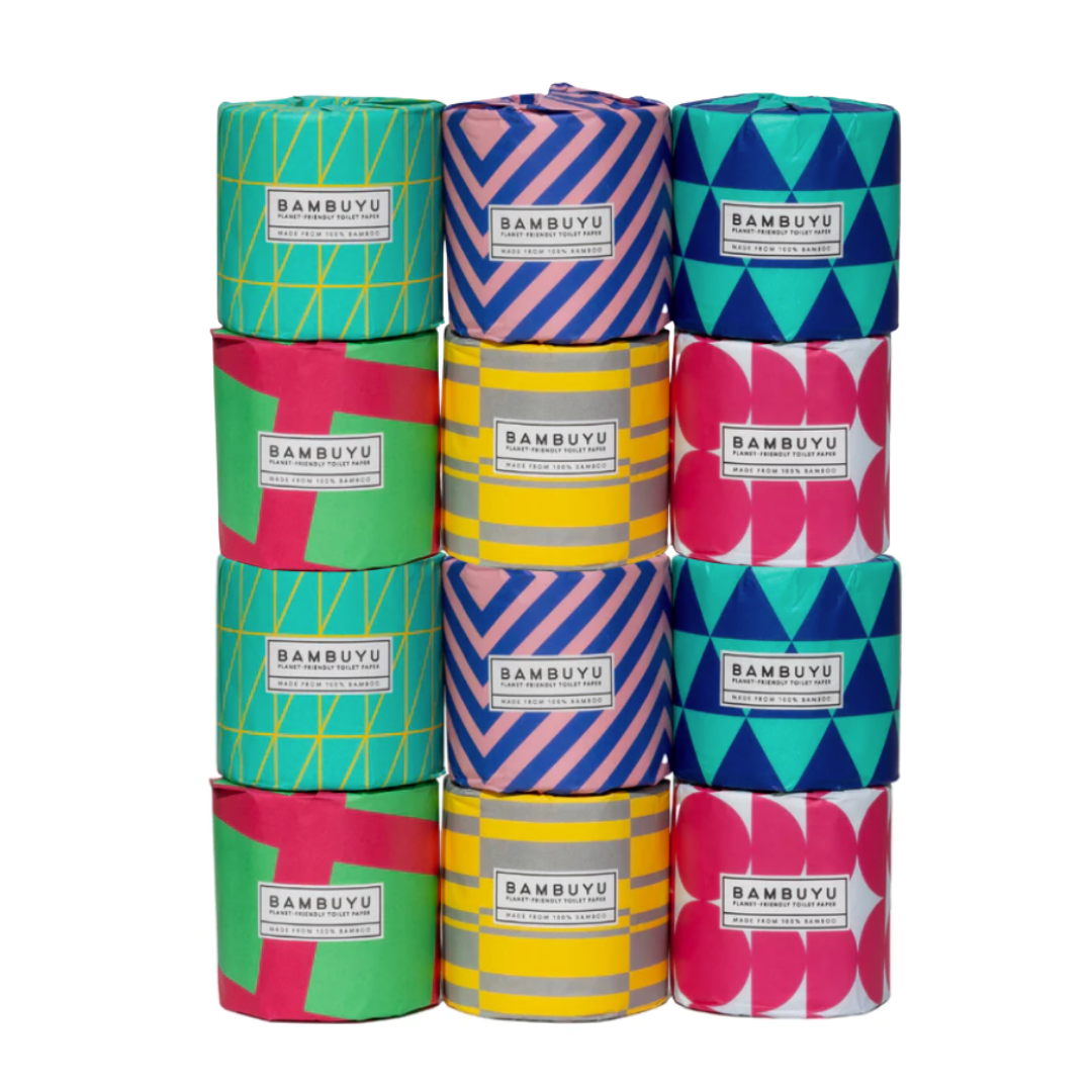 Stack of Bambuyu bamboo toilet paper rolls in assorted colorful geometric designs