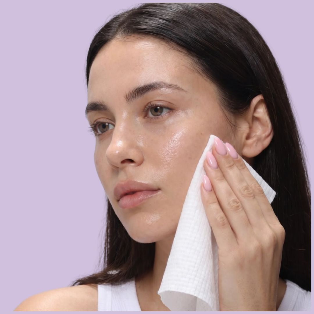 Woman using a Bambuyu bamboo face towel to cleanse her face